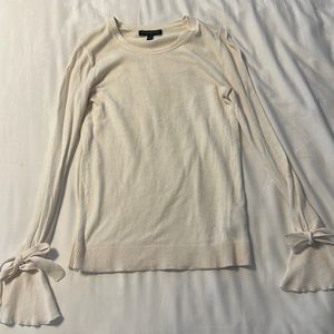 White sweater with bows on wrists